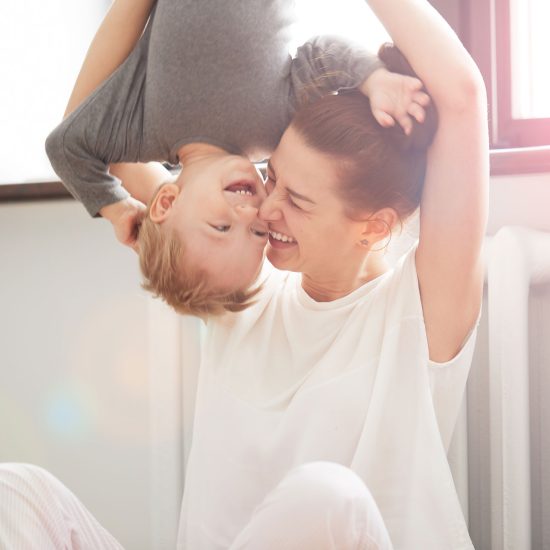 happy-family-mother-and-son-playing-and-smiling-li-V9X2CF2